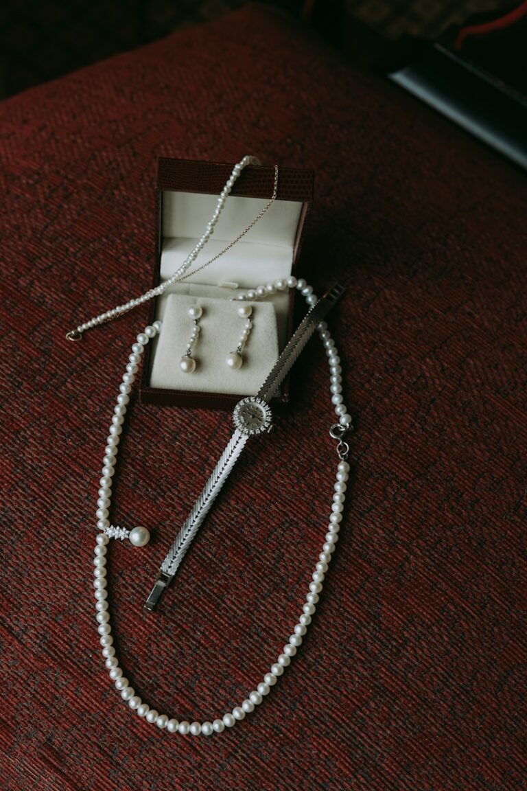 a pearl necklace and a pair of scissors